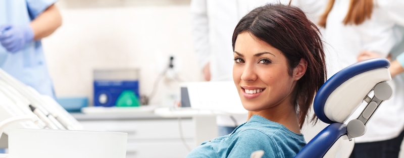 Woman sitting in a dental chair